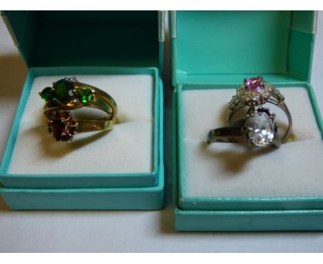 9CT GOLD RUBY CLUSTER DRESS RING, 9CT THREE GREEN STONE CROSSOVER RING, 9CT TOPAZ CLUSTER DRESS RING OVERALL WEIGHT: 8.2G APP