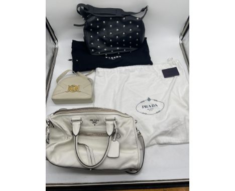 Vintage Prada Leather Handbag, Vintage Versus Versace Leather Shoulder Bag, and other.