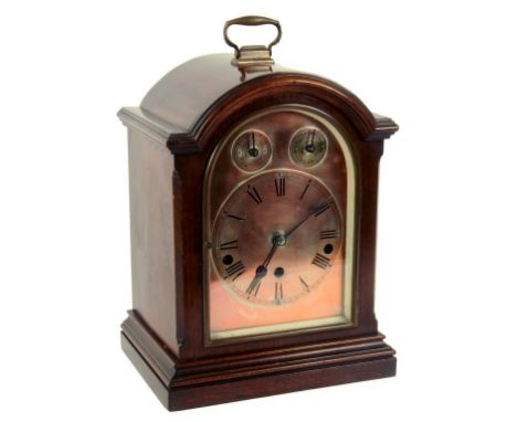 A GERMAN MAHOGANY MANTLE CLOCK IN BREAKARCHED CASE THE MOVEMENT CHIMING ON ROD GONGS