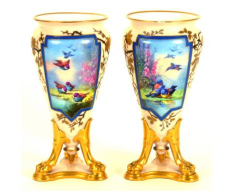 A PAIR OF FRENCH PORCELAIN VASES PAINTED WITH A PANEL OF BIRDS, ON THREE GILT PAW FEET, LATE 19TH CENTURY