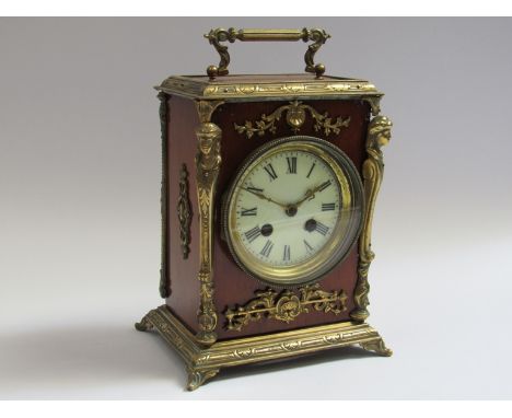 A 19th Century walnut and ormolu striking mantel clock with 8 day Japy Freres movement, Roman enamelled dial, 22cm high exclu