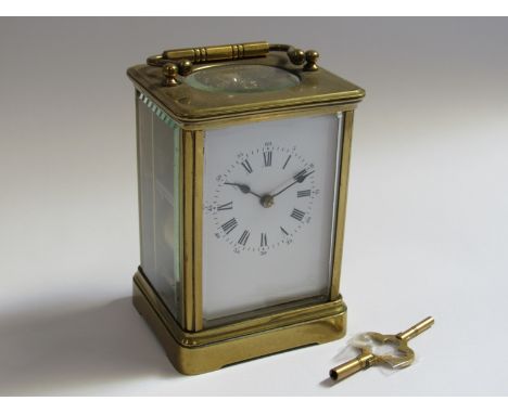 A late 19th Century brass cased striking carriage clock with Roman enamelled dial, possibly later platform Swiss lever escape