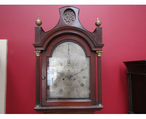 An early 19th Century flame mahogany longcase clock, brass finials and fretwork  top, reeded sides, silvered broken arch dial