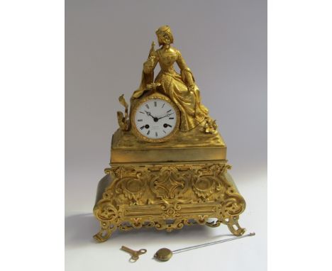 A 19th Century French gilt spelter and brass figural mantel clock depicting maiden with exotic pet bird, Roman enamelled dial