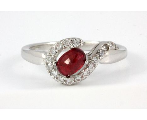 A matching 925 silver ring set with a faceted cut ruby and white stones, (N.5).