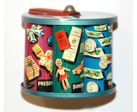 A vintage tin money box.