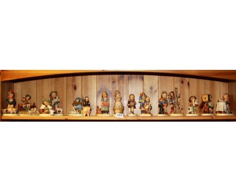 A quantity of Hummel figurines.