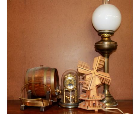 An oil lamp, barrel, clock and windmill.