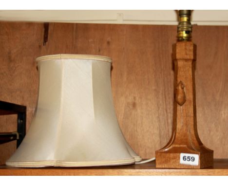 A carved oak Mouseman (Robert Thompson of Kilburn) lamp and shade, lamp base H. 30cm.