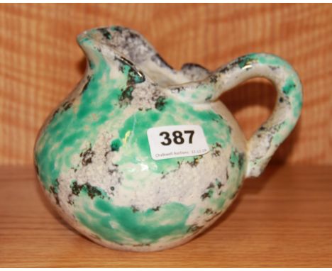 A glazed stoneware ceramic jug by J Massier of Vallauris, H. 15cm.