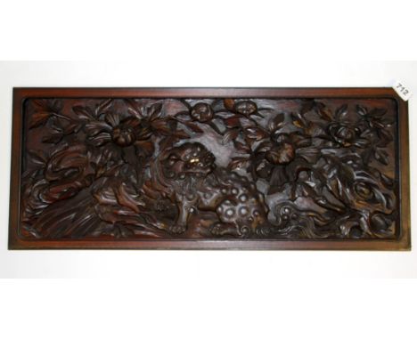 A Japanese carved wooden panel, 73 x 30cm.