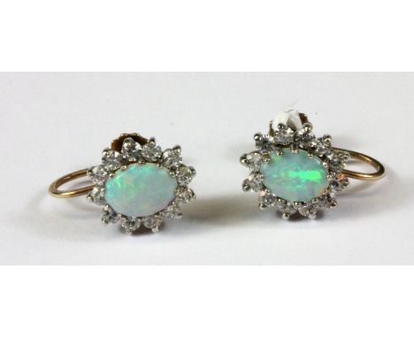 A pair of 9ct yellow gold (stamped 9ct) opal and stone set screw back fitted earrings, L. 1.3cm.