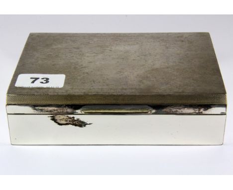 A hallmarked silver cigarette box with engine turned decoration, London, c. 1945, 17 x 13 x 4.5cm.