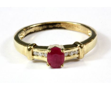 A 9ct yellow gold ruby and diamond set ring, (M.5).