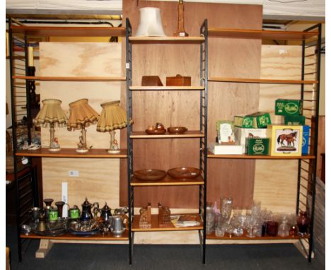 A 1970's teak and metal ladder rack shelving system.