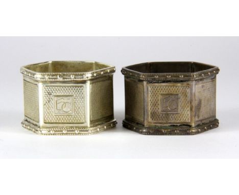 Two hallmarked silver napkin rings with engine turned decoration, Birmingham, c. 1946.