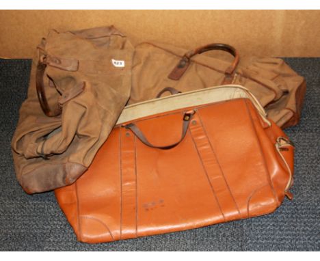 Three vintage leather and canvas gentlemen's bags, L. 59cm.