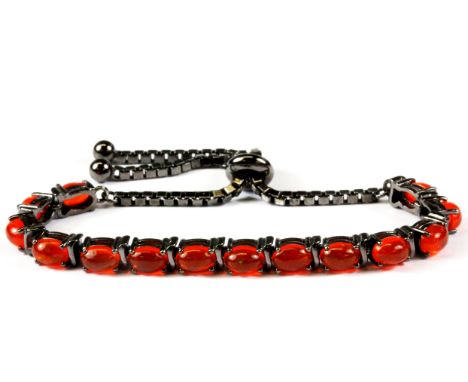 A 925 silver fire opal set adjustable bracelet.