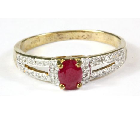 A 9ct yellow gold ruby and diamond set ring, (N).