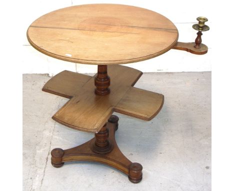 A late 19th early 20th century walnut book/reading table on tripod base, rotary arm with integral candlestick, width 70cm.