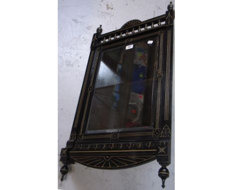 A 19th century ebonised hanging corner display cabinet, glazed door with bevelled edge opening to reveal single shelf, height