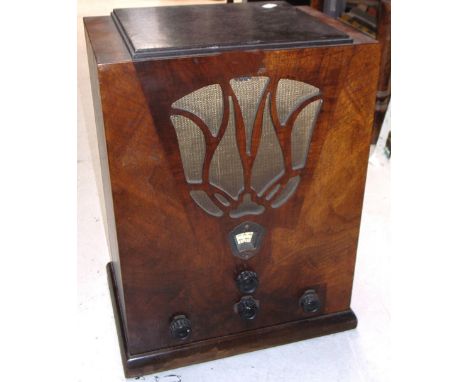 A vintage "Lotus" valve radio with top pierced speaker section, height 50cm.