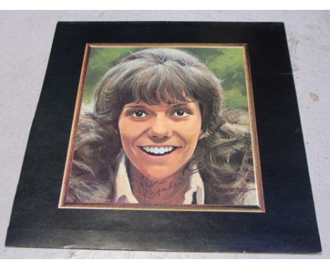 A section from The Carpenters "Now & Then" album sleeve depicting a portrait of Karen Carpenter and bearing her signature.