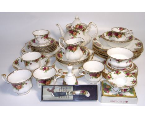 A Royal Albert "Old County Roses" six place dinner service to include plates, side plates, tea pot, milk jug, sugar bowl, cak