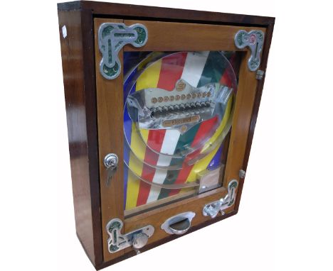 A Bryans "Elevenses" wall mounted bagatelle type slot machine game in original wooden cabinet to accept old one penny pieces,