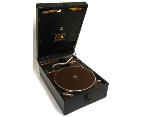 A portable vintage record player and a quantity of 78rpm records.