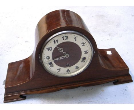 A mid 20th century oak cased mantel clock on bracket feet, silvered dial set with Arabic numerals, width approx 45cm.