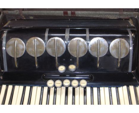 A Scandalli piano accordion in original carry case.