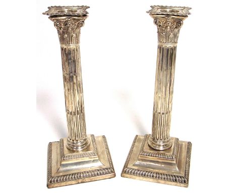 A pair of Victorian hallmarked silver Corinthean column loaded candlesticks, Sheffield 1892, approx height 23cm.  CONDITION R