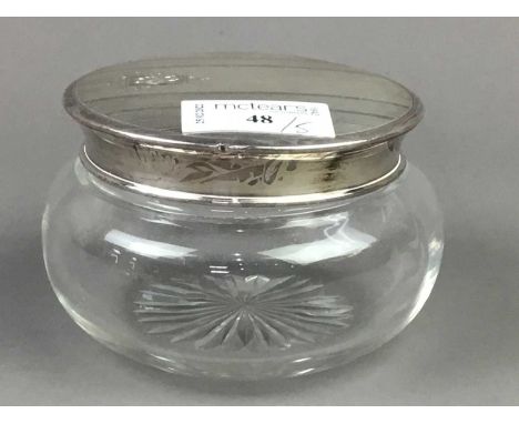 SILVER TOPPED GLASS POWDER BOWL,along with a silver topped toilet jar, a pair of silver candlesticks and a silver mounted per