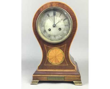EDWARDIAN MAHOGANY MANTEL CLOCK,with engine turned silverised dial with eight day movement, in a balloon head case, on brass 