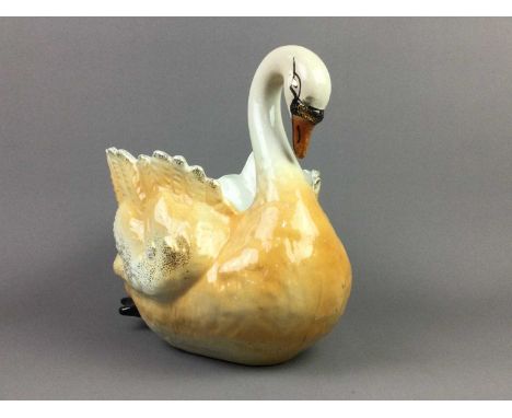 EARLY 20TH CENTURY STONEWARE PLANTER,modelled in the form of a swan, 30cm high, along with another, 26cm high (2)
