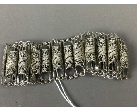 EASTERN FILIGREE WHITE METAL BRACELET,along with a gilt and enamel bracelet, two rings and a pendant modelled in the form of 