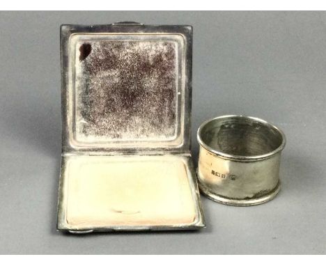 ENGINE TURNED SILVER COMPACT,along with a silver napkin ring (2)