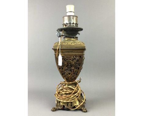 VICTORIAN GILDED BRASS OIL LAMP,converted to electricity, 45cm high to sconce, along with a pair of brass candlesticks and an
