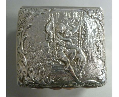 An Edwardian silver rectangular trinket box, embossed with an ethereal scene, two figures on a swing in a woodland setting  H