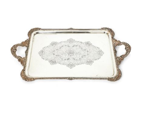 A silver large rounded rectangular twin handled tray by James Dixon &amp; Sons (James Willis Dixon), London 1903, with foliat