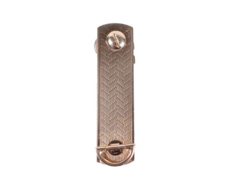 A 9 carat gold key holder by S. J. Rose &amp; Son, the oblong case with engine turned decoration, enclosing two un-cut keys, 