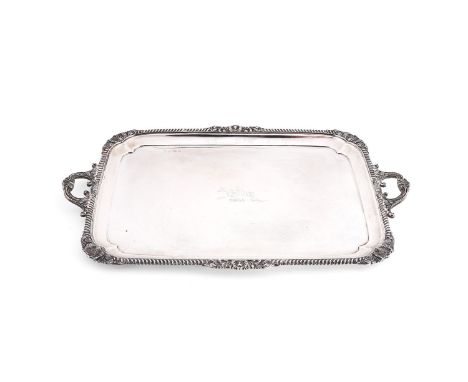 A silver large rounded rectangular twin handled tray by Elkington &amp; Co., Birmingham 1913, with foliate loop handles, a ra