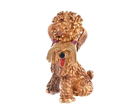 A poodle clip brooch, with textured modelling, tassels for the whiskers and black enamel for the nose and tongue, the eyes se