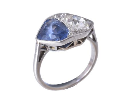 An Art Deco sapphire and diamond ring, circa 1925, the old cut diamond approximately 0.70 carats and the triangular shape sap