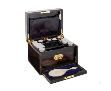 A Victorian coromandel toilet case by Mappin &amp; Webb, the fitted interior with nine clear glass and silver jars, boxes and