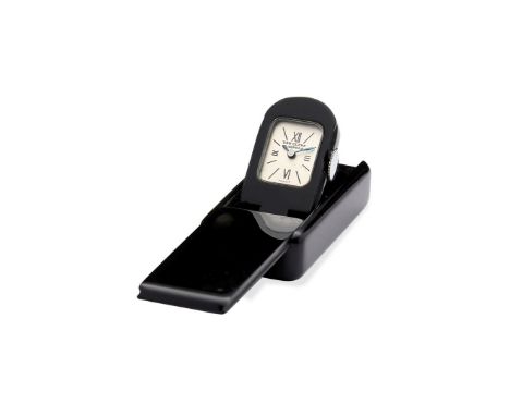 Van Cleef &amp; Arpels, a black resin purse watch, no. 84912, unsigned manual wind movement, silvered dial, Roman numerals, b