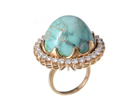 A turquoise and diamond ring by Sanz, the circular sugarloaf cabochon turquoise claw set within a surround of brilliant cut d