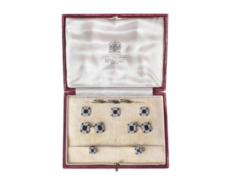 A 1920s diamond and onyx dress set, the double sided cufflinks centrally set with a rectangular cut onyx within a surround of