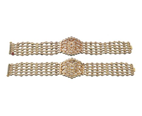 A pair of Jaipur enamel and diamond bracelets, the articulated bracelets set with polki diamonds, the reverse in red and gree